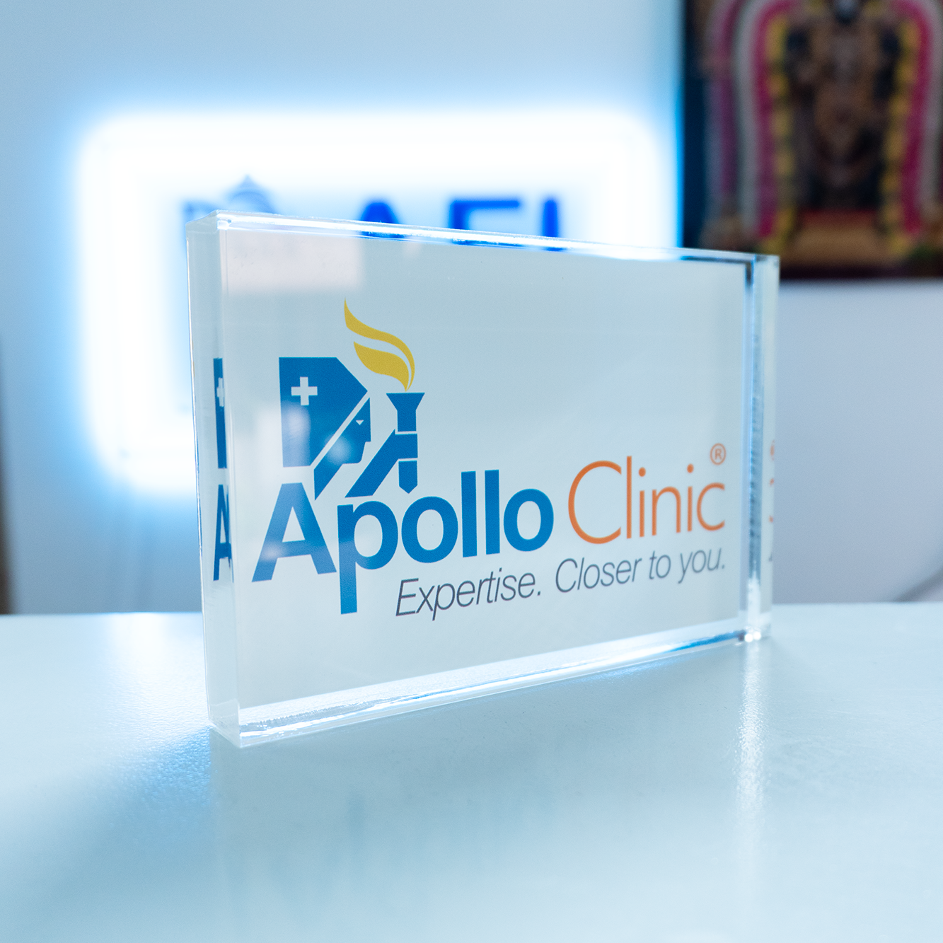 Acrylic Block with Apollo Clinic logo on a reflective surface